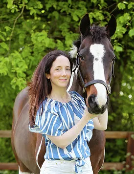 Daisy Smith with a brown horse